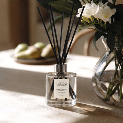 Hideaway Home Fragrances autumn pear and white freesia reed diffuser with crisp melon, rose, and patchouli