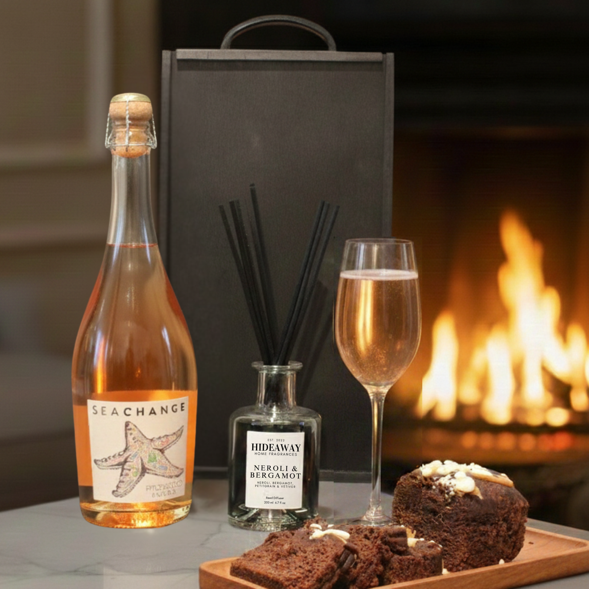 Close up of the Cartwright & Butler chocolate cake tin and black wooden gift box texture.  