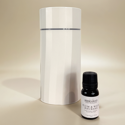 Bold, uplifting scent blending sun-ripened plums, rhubarb, and vanilla musk in a luxurious fragrance oil – Hideaway Home Fragrances.