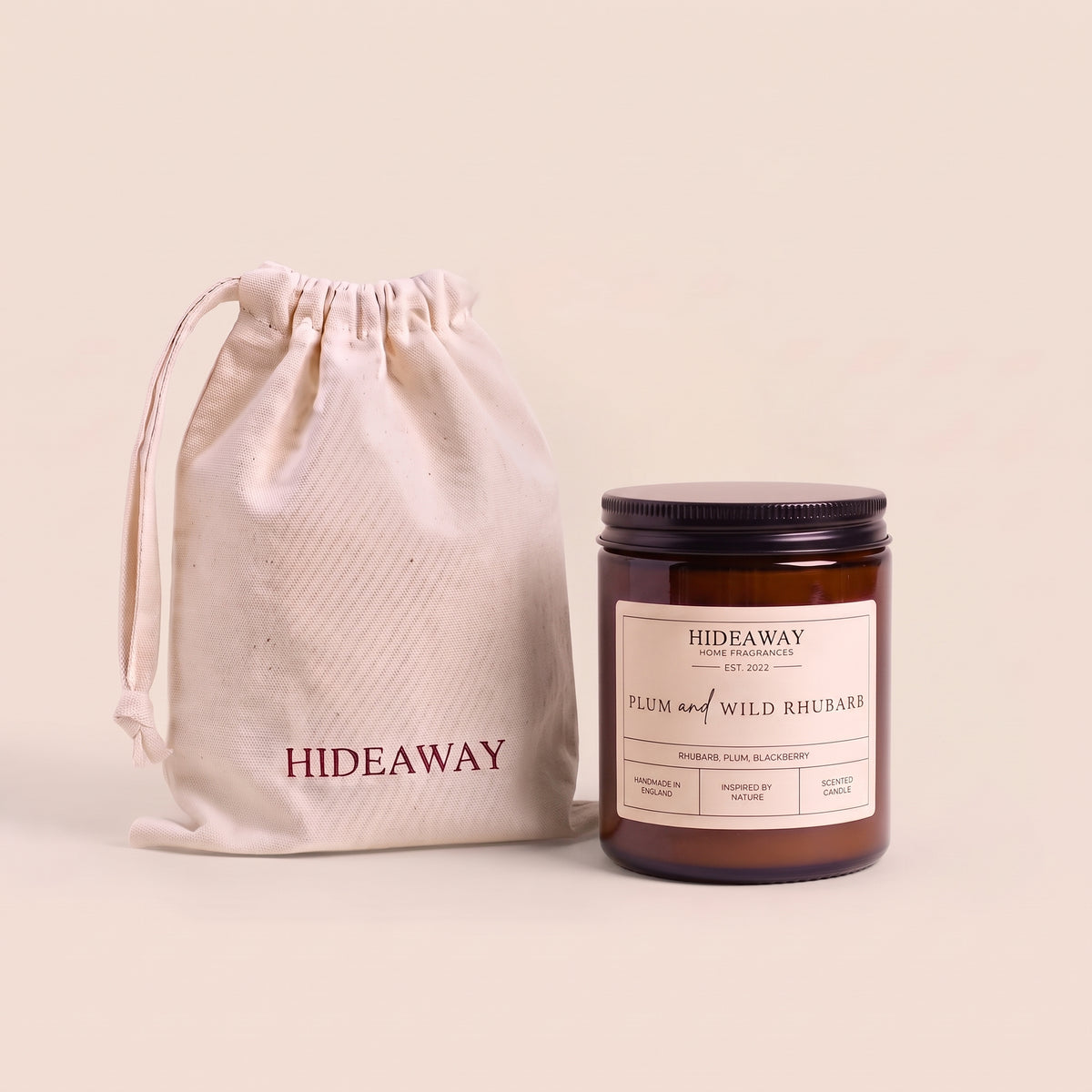 Rich plum and wild rhubarb aromatic candle in an amber glass jar creating a warm inviting atmosphere from Hideaway Home Fragrances
