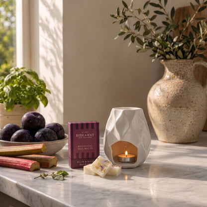 Artisan plum and wild rhubarb botanical wax melt snap bar by Hideaway Home Fragrances garnished with dried fruit and floral botanicals