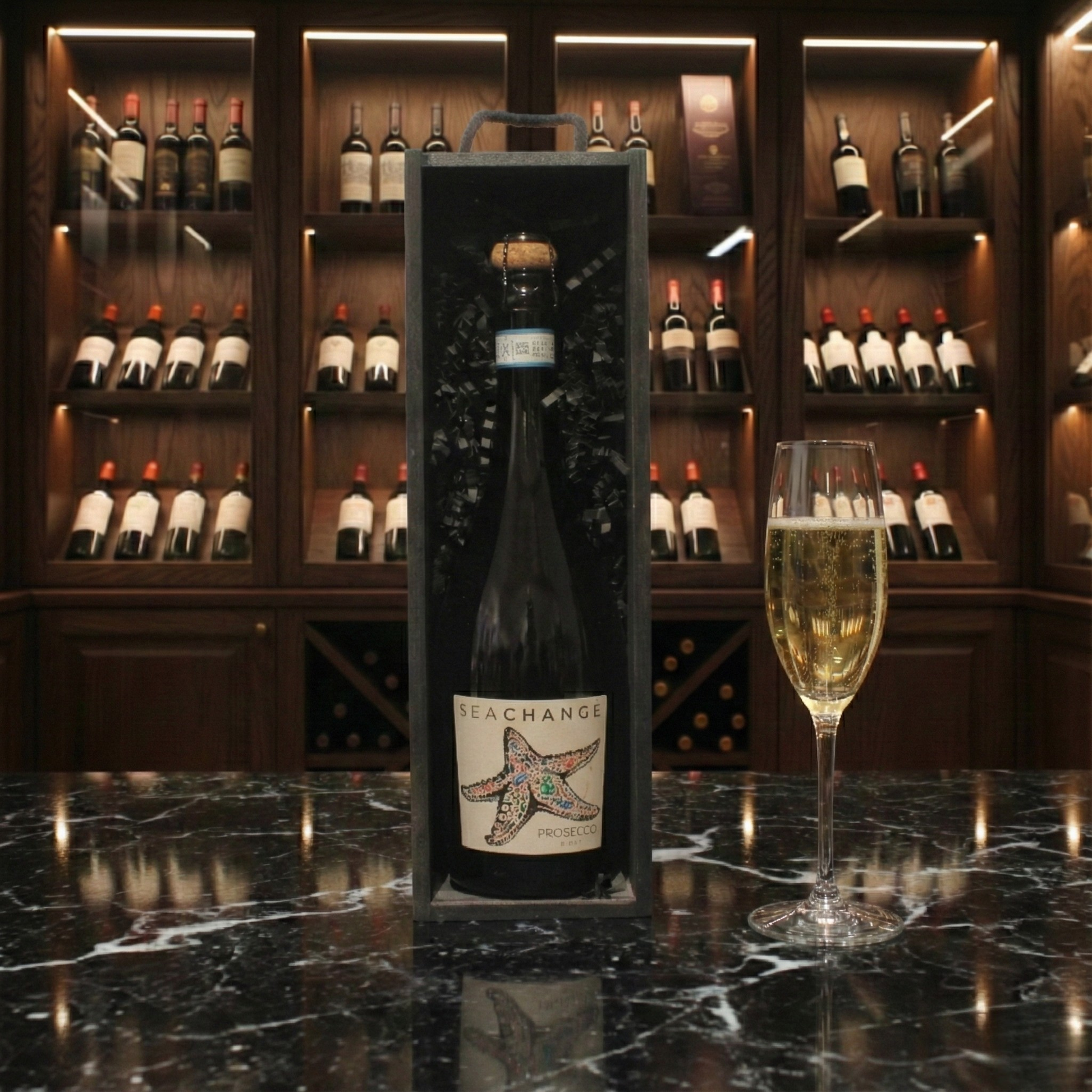 The Prosecco Reserve Gift Box featuring a bottle of Sea Change Prosecco inside a sleek black wooden wine box.