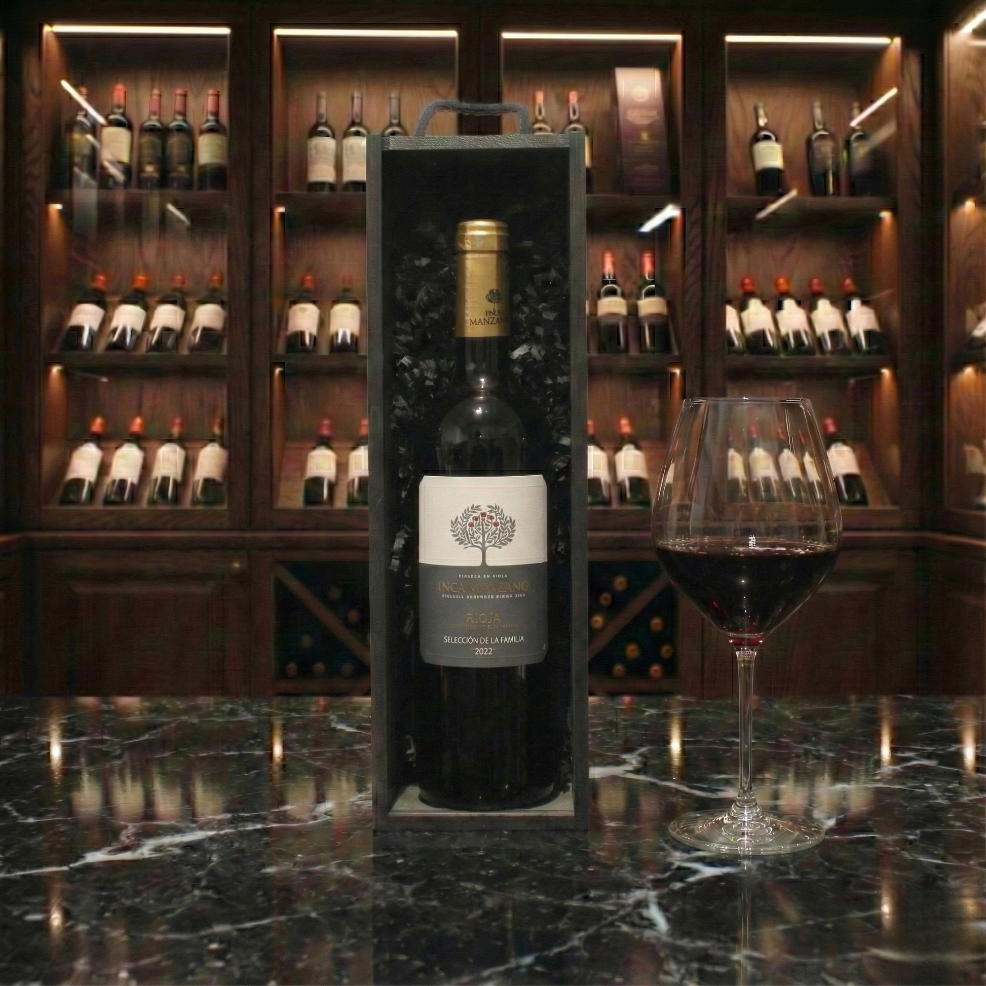 The Wine Cellar Gift Box featuring a bottle of Finca Manzanos Rioja inside a sleek black wooden wine box.