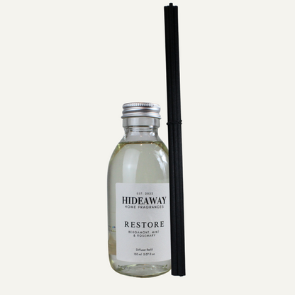 Restore Reed Diffuser Refill with bergamot, mint, rosemary, and woody undertones – refreshing, energising, and balanced scent – Hideaway Home Fragrances