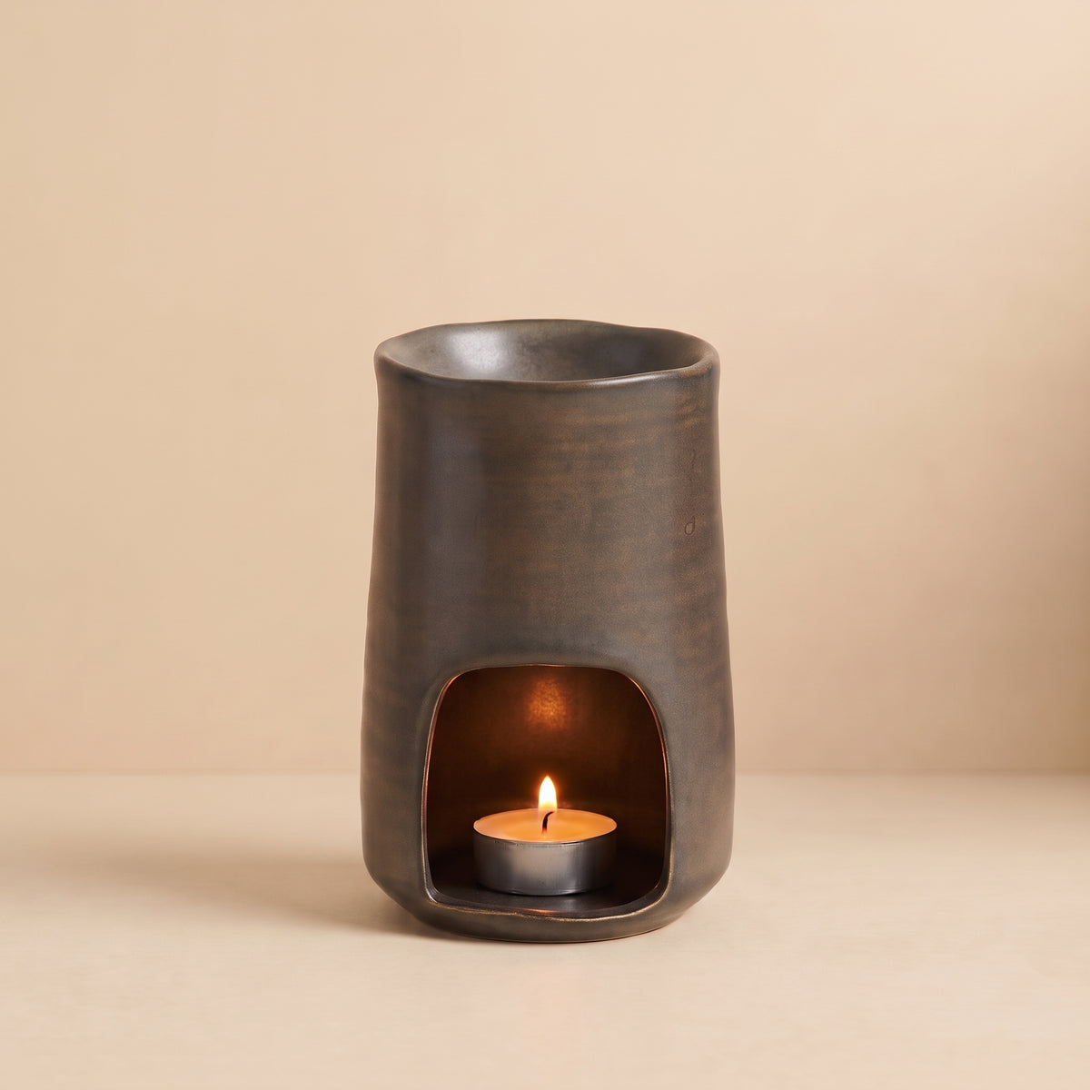 Hideaway Home Fragrances Rustic Ceramic Burner styled on a wooden tabletop in a cosy, warm-toned country home setting