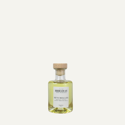 Seychelles home fragrance diffuser, sun warmed tropical scent with coconut almond and amber notes