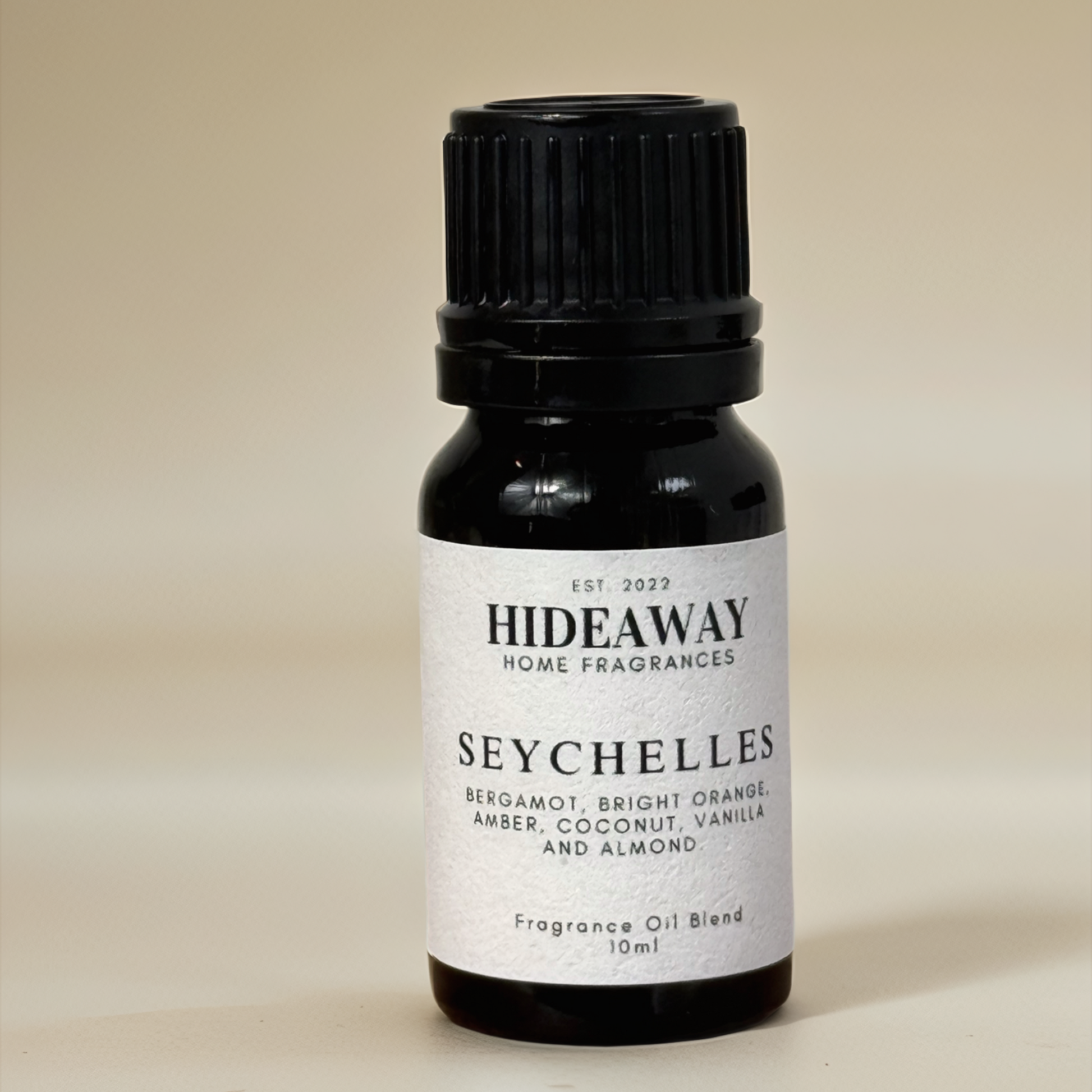Seychelles Fragrance Oil with bright bergamot, sweet orange, warm amber, and creamy coconut in a soothing tropical blend — Hideaway Home Fragrances