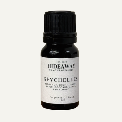 Seychelles Fragrance Oil with bright bergamot, sweet orange, warm amber, and creamy coconut in a soothing tropical blend — Hideaway Home Fragrances
