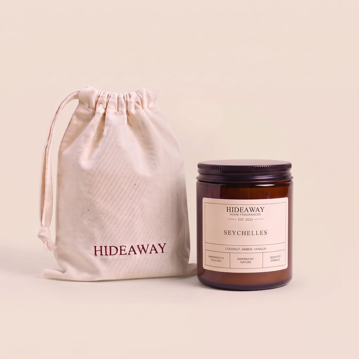 Exotic Seychelles aromatic candle in an amber glass jar creating a tropical beach getaway mood from Hideaway Home Fragrances