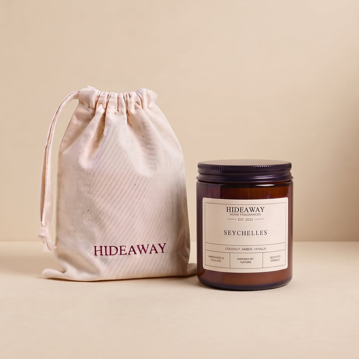 Exotic Seychelles aromatic candle in an amber glass jar creating a tropical beach getaway mood from Hideaway Home Fragrances