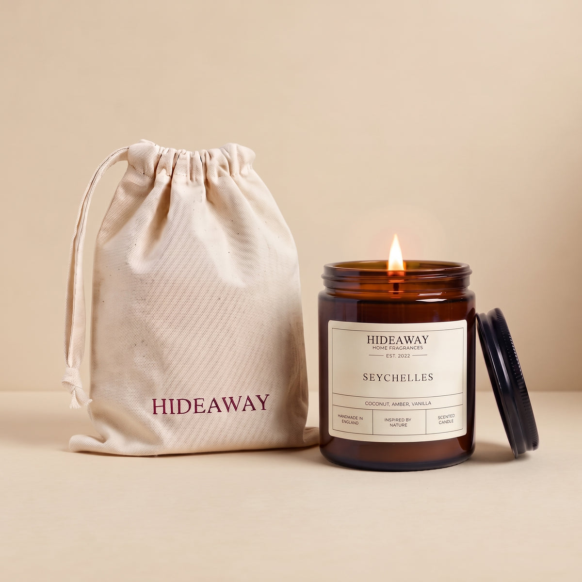 Seychelles amber glass candle with exotic tropical island scent by Hideaway Home Fragrances