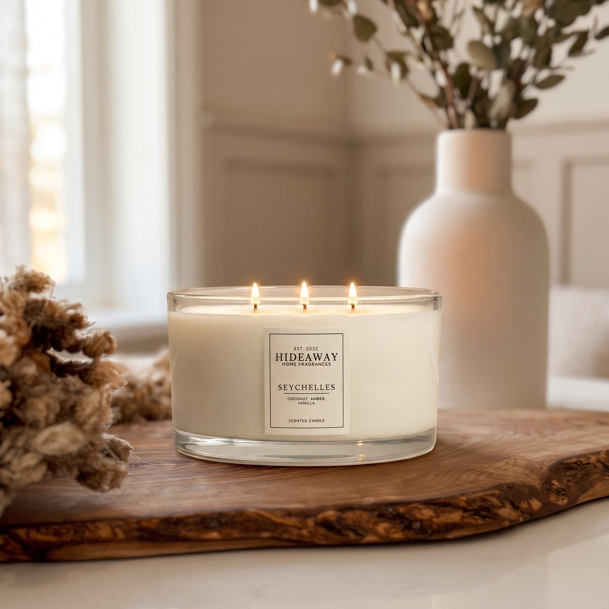 Seychelles 3-wick luxury candle with citrus and tropical notes creating a sunny, relaxing home atmosphere