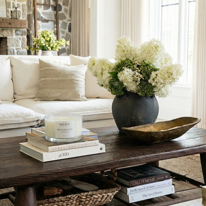 Tropical Seychelles three-wick candle filling a room with exotic, soothing fragrance for island-inspired serenity