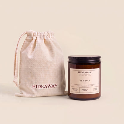 Lit Spa Day luxury scented candle in an amber glass jar, providing a calming botanical scent by Hideaway Home Fragrances.