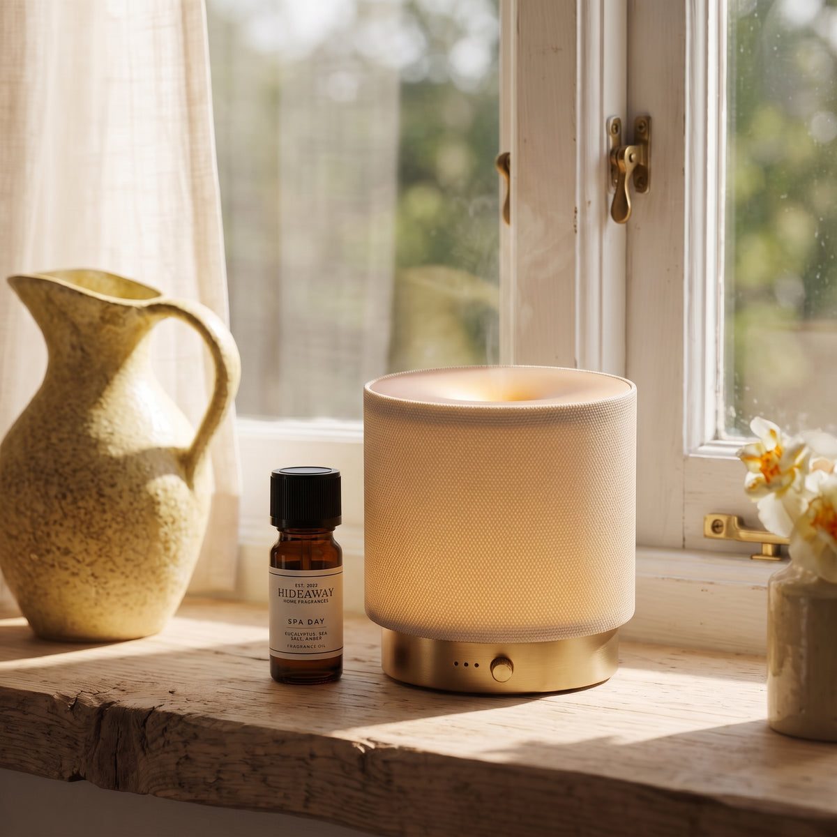 Fragrance notes breakdown for Hideaway Home Fragrances spa day fragrance oil featuring invigorating eucalyptus, fresh sea salt, soothing lilac, and golden amber.