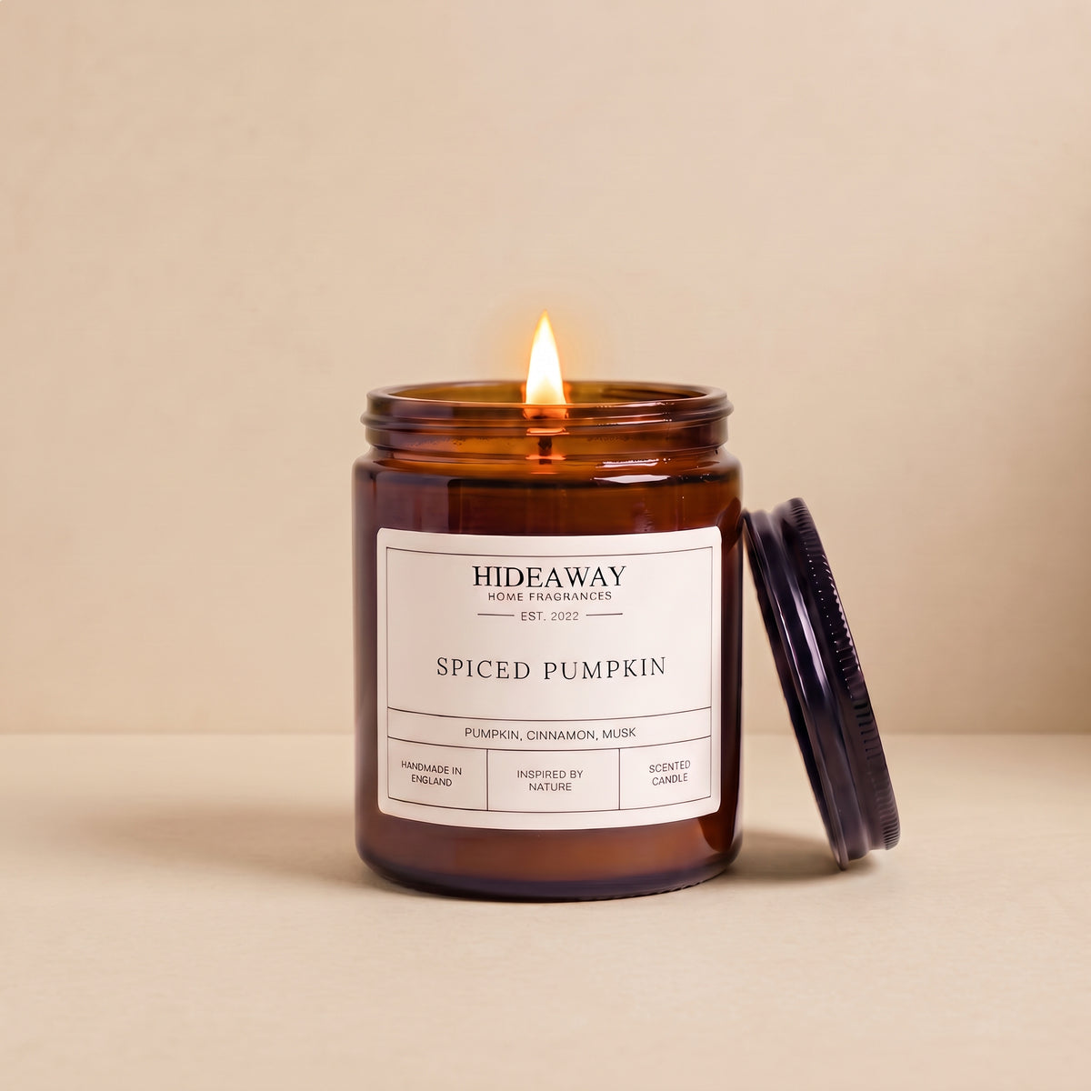 Hand-poured spiced pumpkin amber glass candle featuring rich notes of nutmeg, cinnamon, and sweet pumpkin puree, Hideaway Home Fragrances