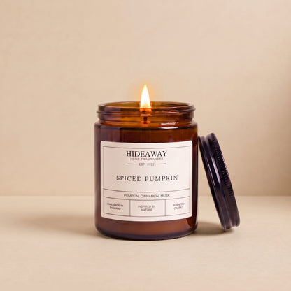 Hand-poured spiced pumpkin amber glass candle featuring rich notes of nutmeg, cinnamon, and sweet pumpkin puree, Hideaway Home Fragrances
