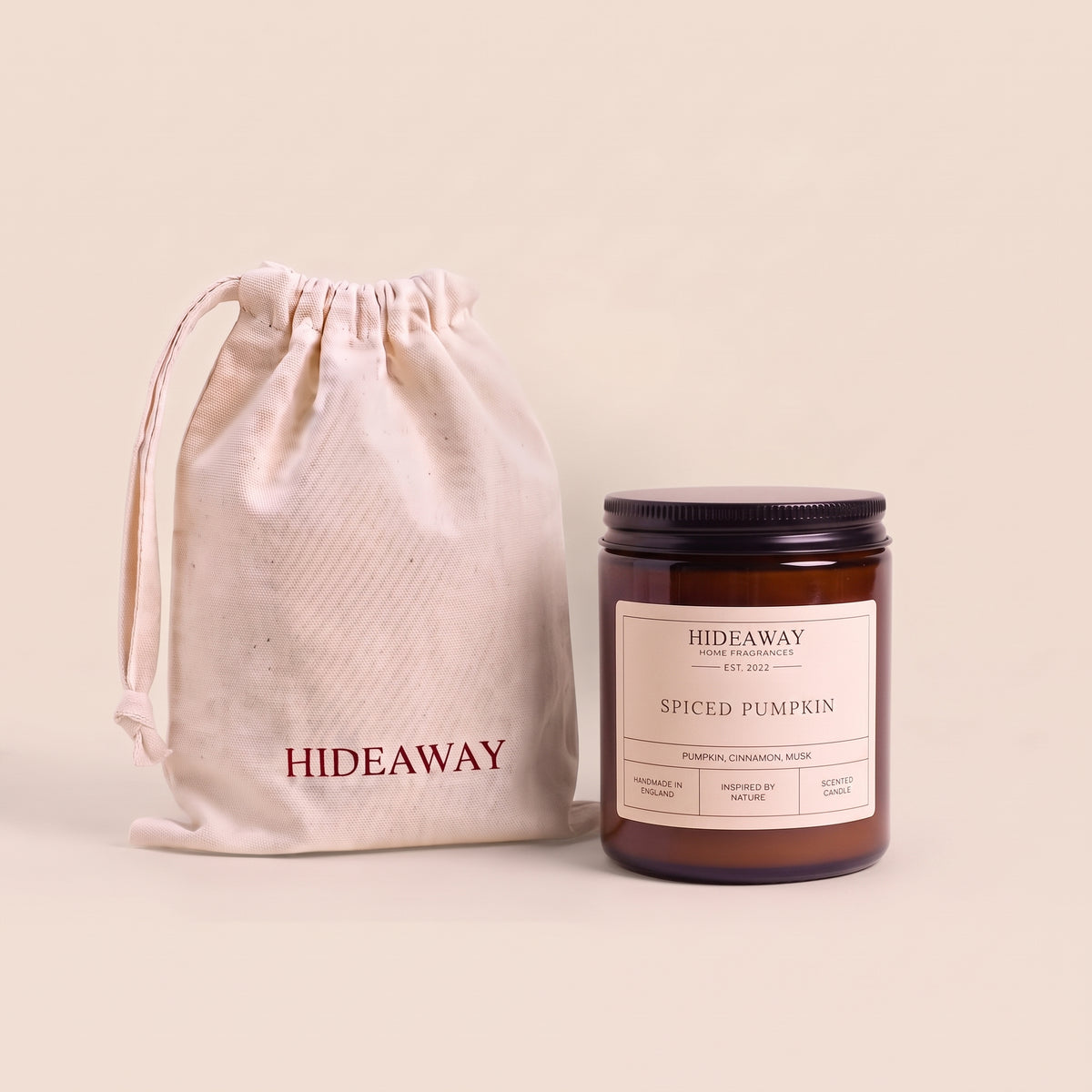 Warm spiced pumpkin aromatic candle in an amber glass jar creating a cozy autumn atmosphere from Hideaway Home Fragrances