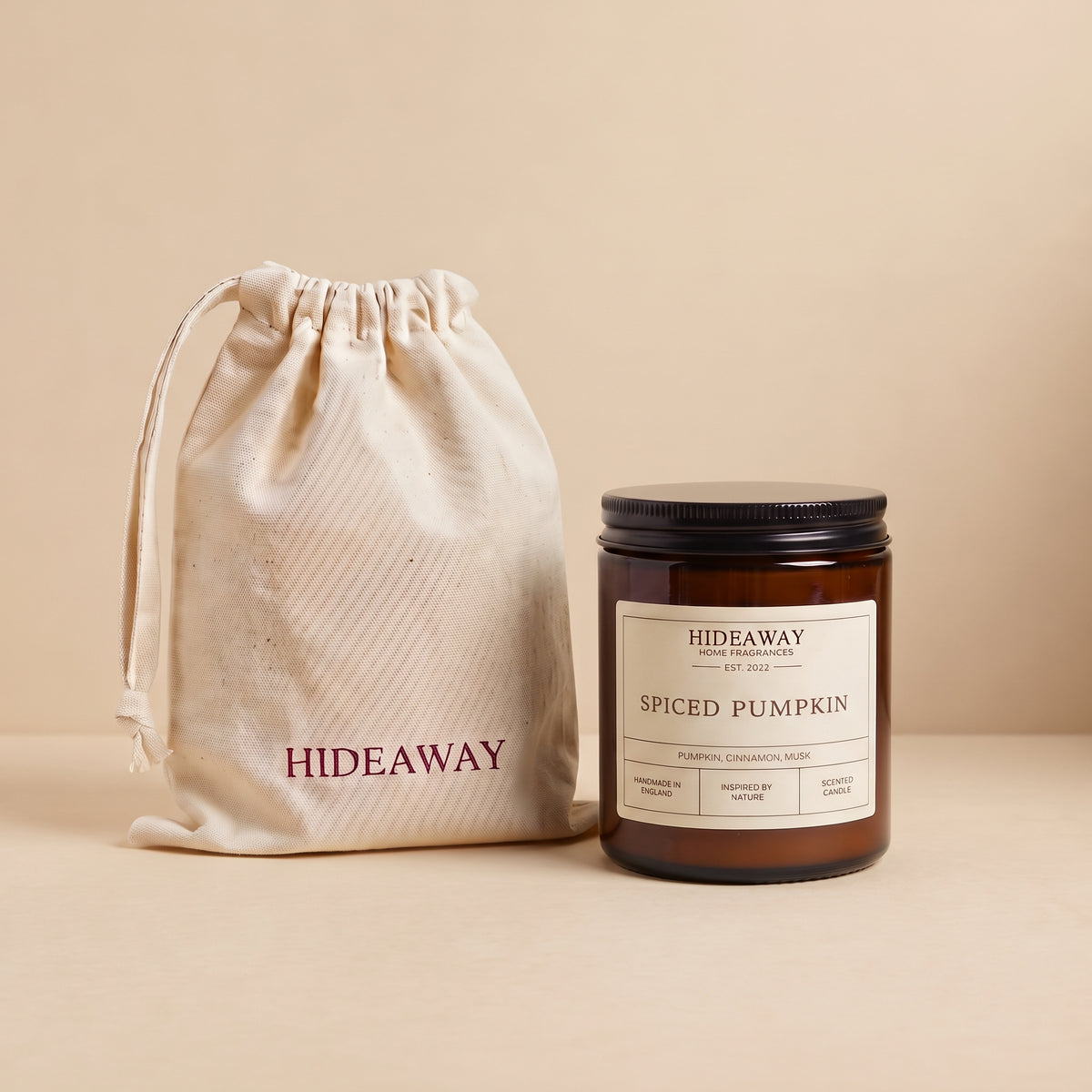 Warm spiced pumpkin aromatic candle in an amber glass jar creating a cozy autumn atmosphere from Hideaway Home Fragrances