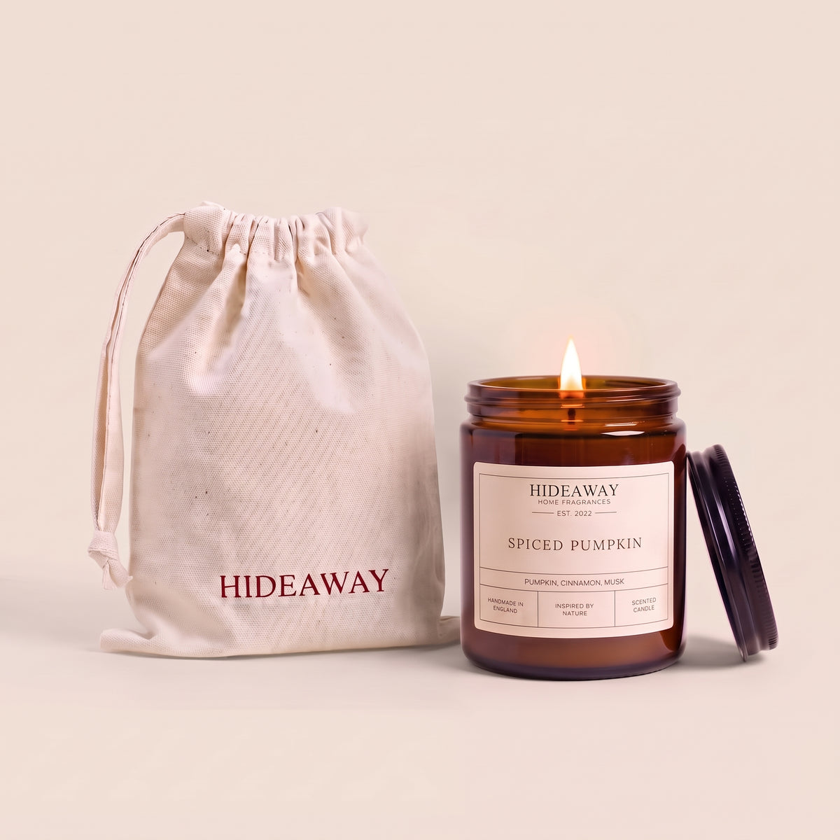 Spiced pumpkin amber glass candle with warm autumn spice scent by Hideaway Home Fragrances