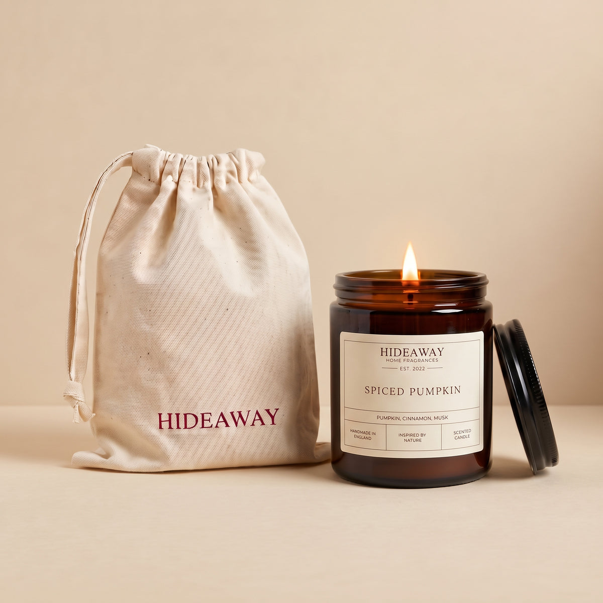 Spiced pumpkin amber glass candle with warm autumn spice scent by Hideaway Home Fragrances