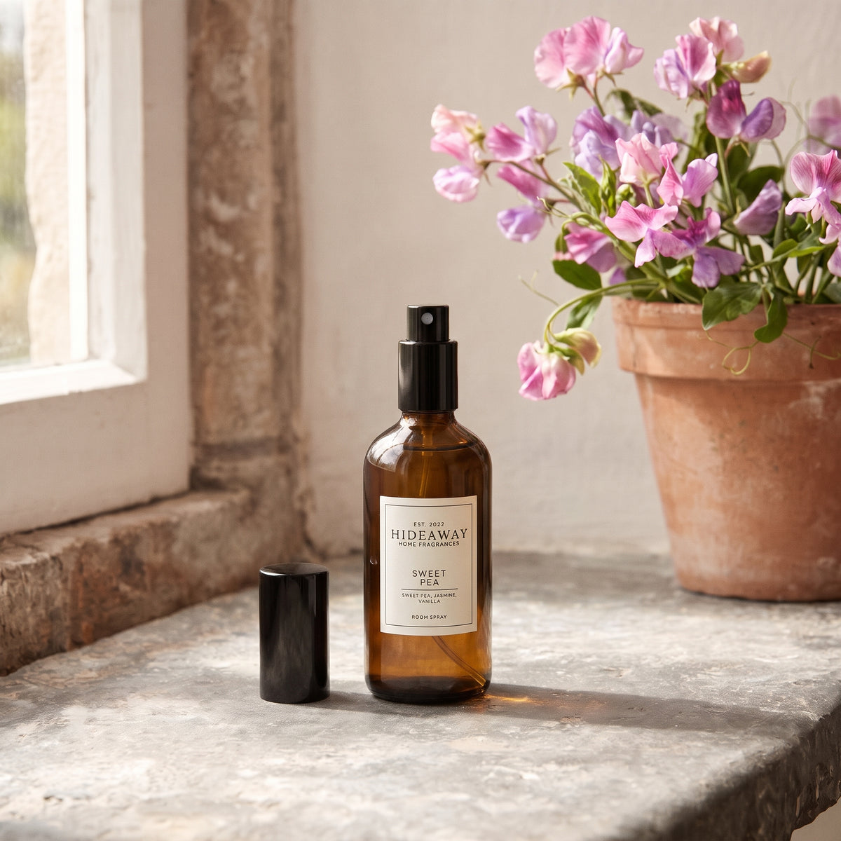 Fragrance notes breakdown for Hideaway Home Fragrances sweet pea room spray featuring delicate sweet pea, hyacinth, blooming jasmine, and warm woods.