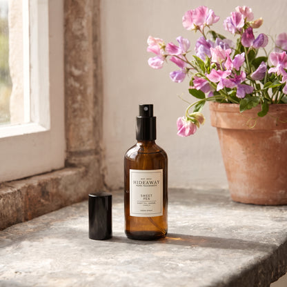 Fragrance notes breakdown for Hideaway Home Fragrances sweet pea room spray featuring delicate sweet pea, hyacinth, blooming jasmine, and warm woods.