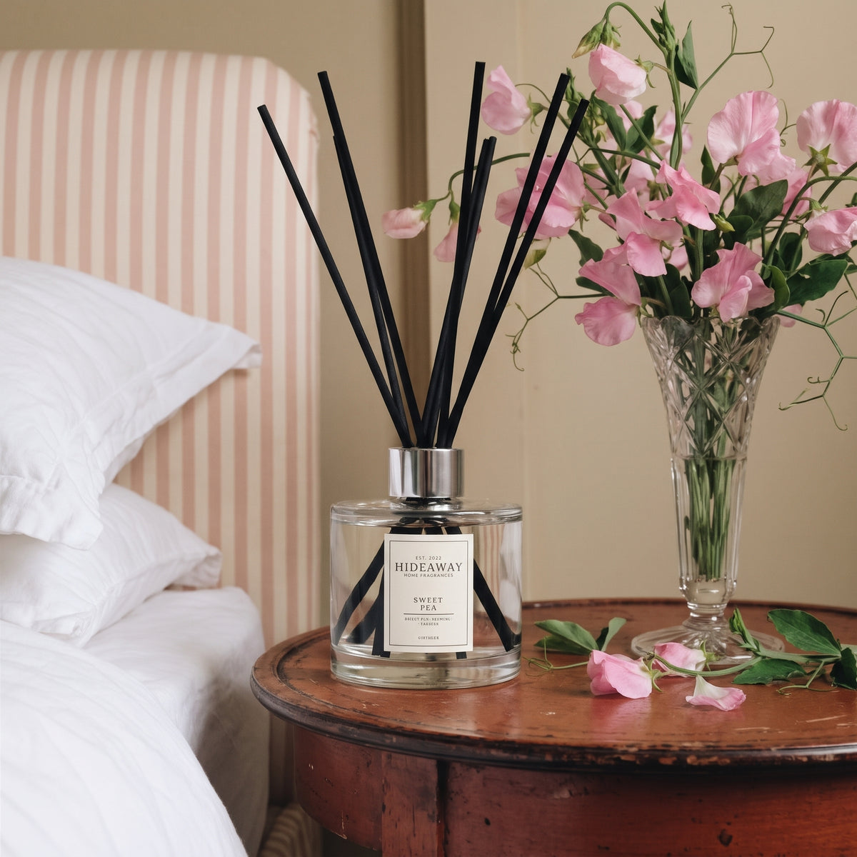 Sweet pea reed diffuser by Hideaway Home Fragrances featuring hyacinth, sweet pea, and warm woods