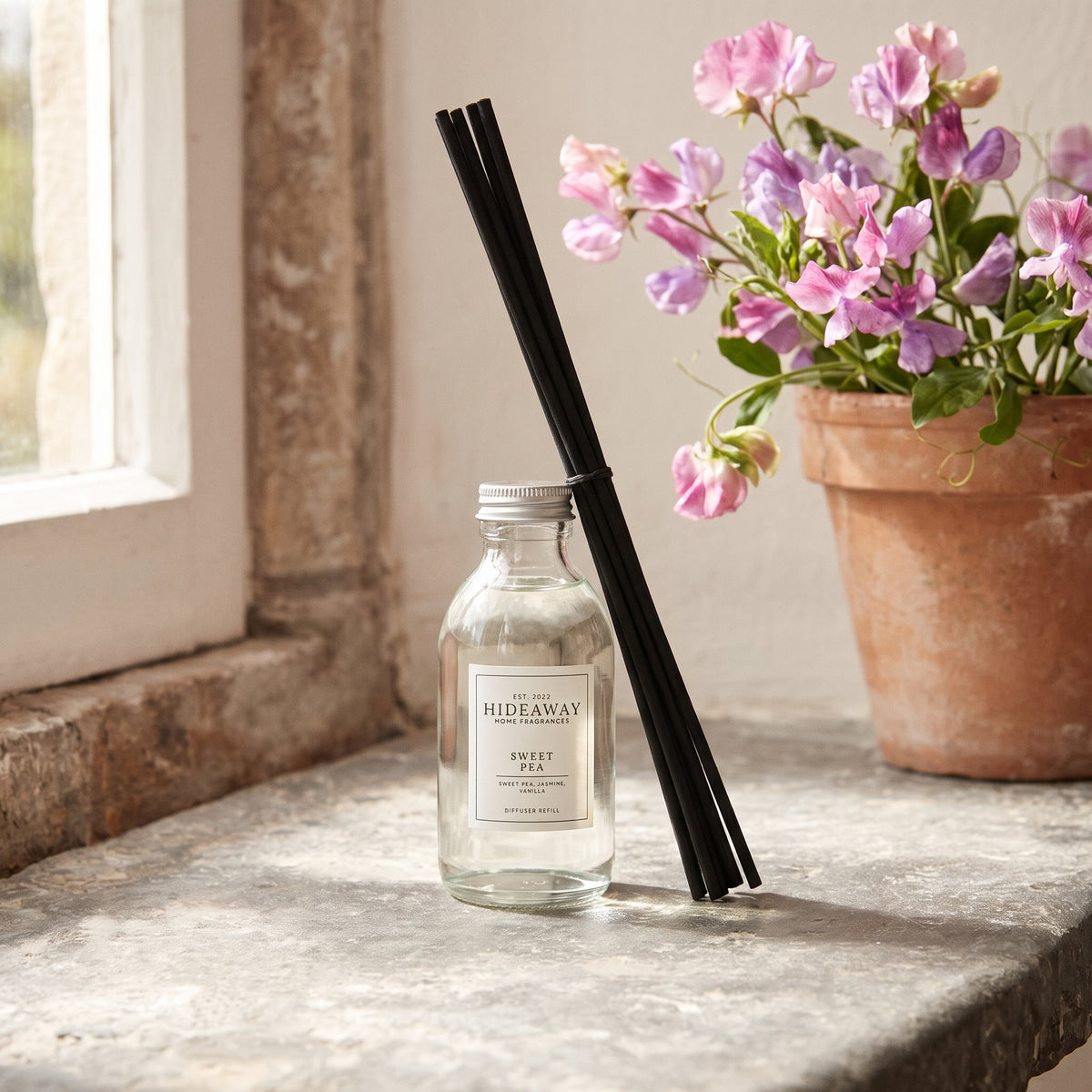 Sweet pea diffuser oil refill by Hideaway Home Fragrances featuring hyacinth, jasmine, and warm woods