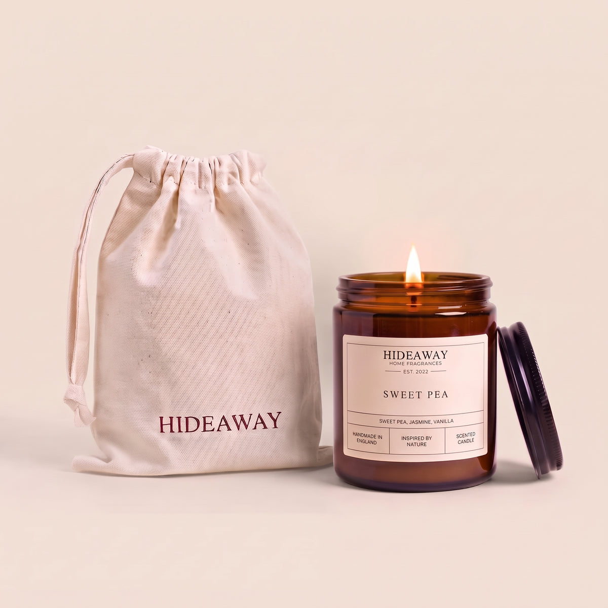 Sweet pea amber glass candle with delicate floral scent by Hideaway Home Fragrances