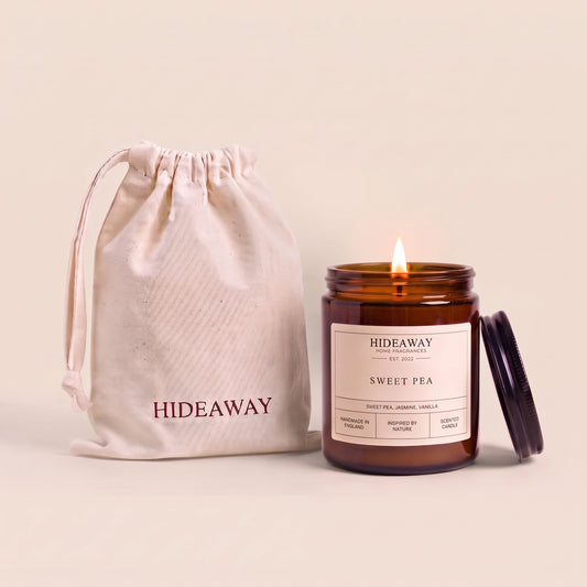 Sweet pea amber glass candle with delicate floral scent by Hideaway Home Fragrances