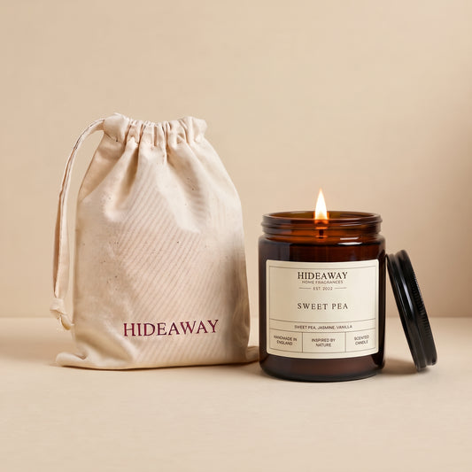Sweet pea amber glass candle with delicate floral scent by Hideaway Home Fragrances