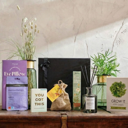 The Calming Ritual wellness hamper featuring Myga lavender eye pillow, Hideaway reed diffuser, and Native Wildflower Beebombs.