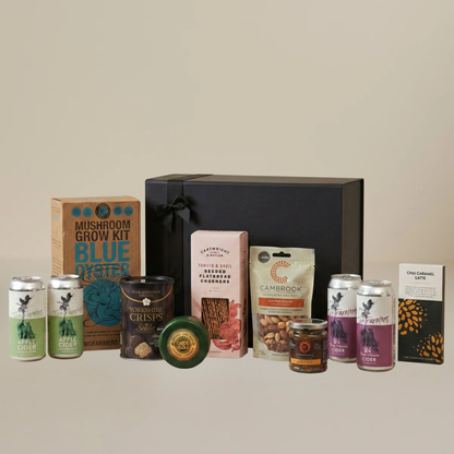 Artisan food gift set flatlay with Yorkshire Truffle Crisps, Cartwright & Butler flatbreads, artisan chocolate bar, and roasted peanuts.