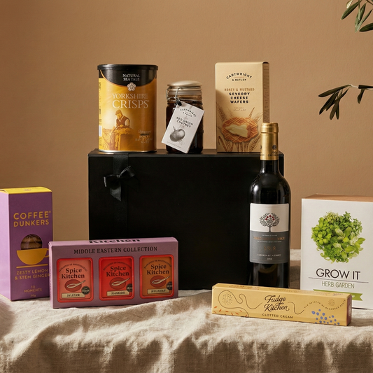 The Field to Feast luxury hamper featuring Finca Manzanos Rioja, Spice Kitchen tins, and Herb Garden Grow Kit.