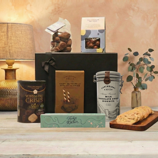 The Gentlefolk Gift Hamper Collection featuring Cartwright & Butler biscuits, Chocolate Society honeycomb, and Yorkshire Crisps.