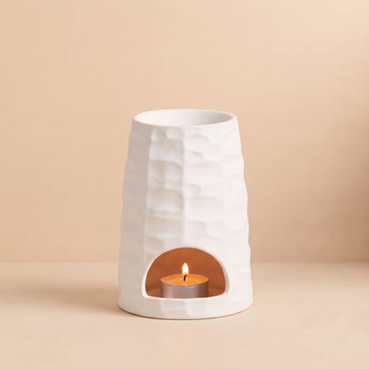 Soothing warm glow from The Hive ceramic wax melt burner by Hideaway Home Fragrances diffusing home fragrance