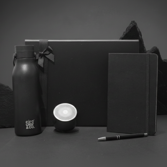 Vision & Volume Gift Box featuring Swiss Peak speaker, recycled stainless steel water bottle, and A5 notebook.