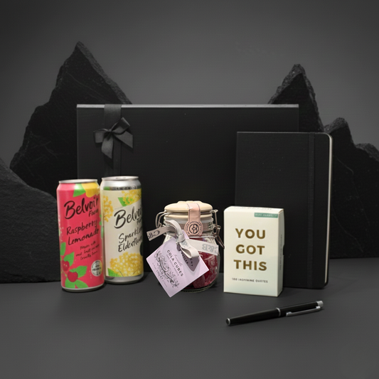 Pause & Propel gift box featuring A5 notebook, Belvoir soft drink, affirmation cards, and sweet jar.
