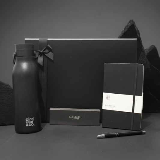 The Executive Flow Gift Box featuring A5 notebook, recycled aluminium pen set, and recycled stainless steel water bottle.