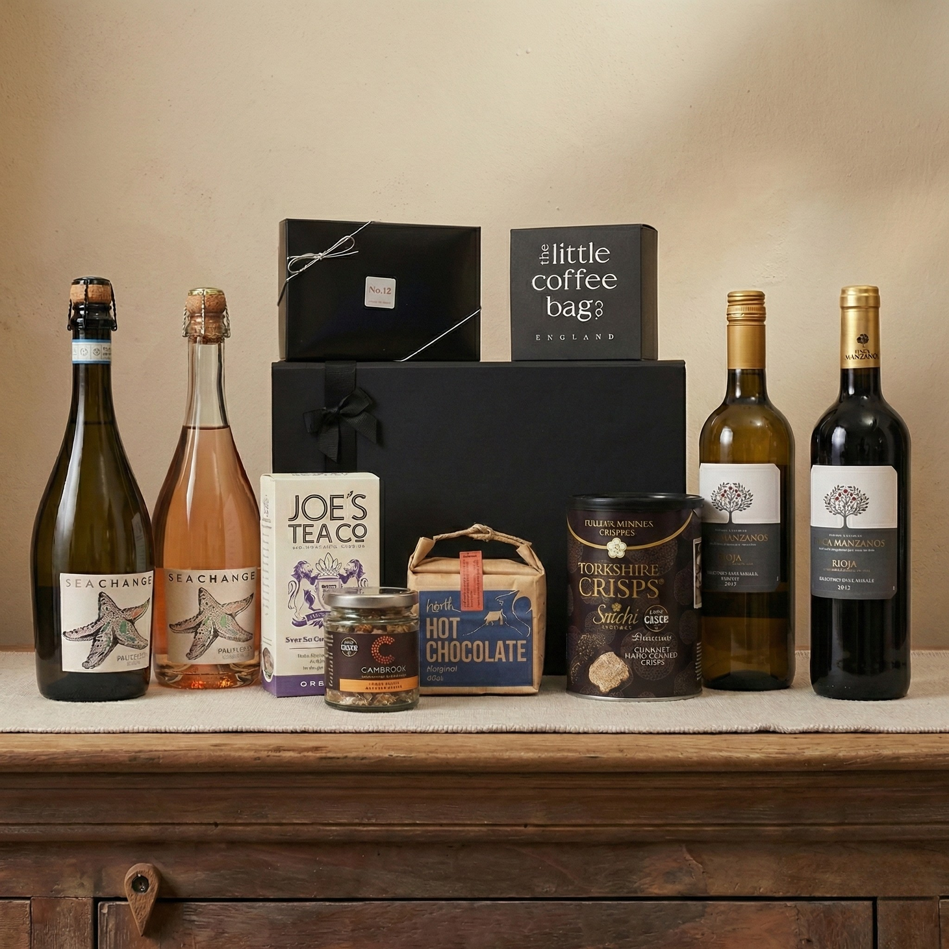 The Cellar Edit luxury hamper featuring Finca Manzanos Rioja and Blanco wines, Sea Change Prosecco, and Yorkshire Truffle Crisps.