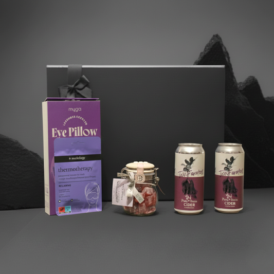 Orchard & Slumber gift set featuring Two Farmers cider, Myga lavender eye pillow, and Cartwright & Butler sweet jar.