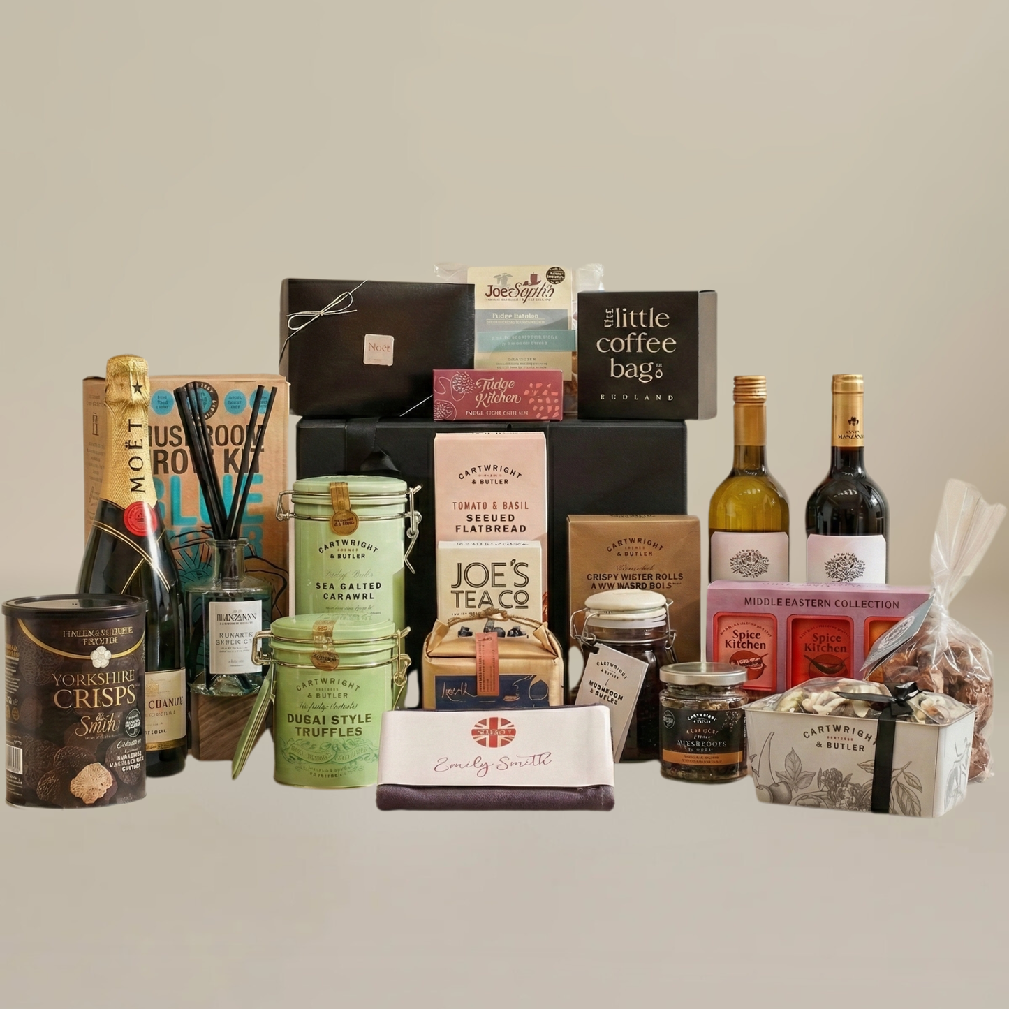 Large luxury hamper flatlay with Dubai truffles, mushroom grow kit, reed diffuser, artisan chocolates, and savoury snacks.