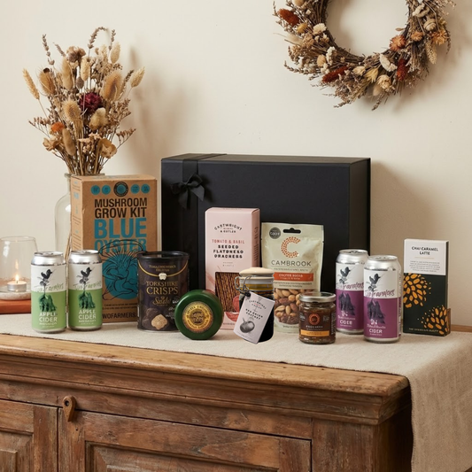 The Masters Larder Gift Hamper featuring Two Farmers Apple and Berry Ciders, Mouse House cheese truckle, and Mushroom Grow Kit.
