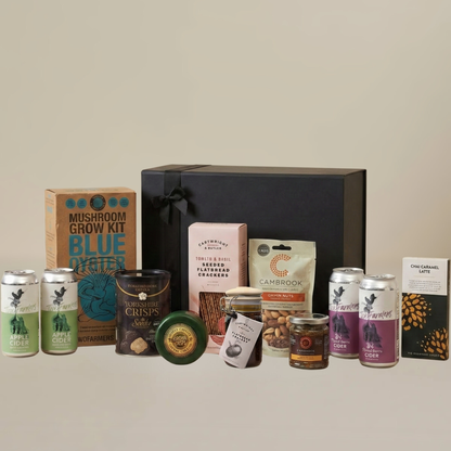 Savory food gift set flatlay with Yorkshire Crisps, Cartwright & Butler flatbreads, chutney jar, and artisan chocolate bar.