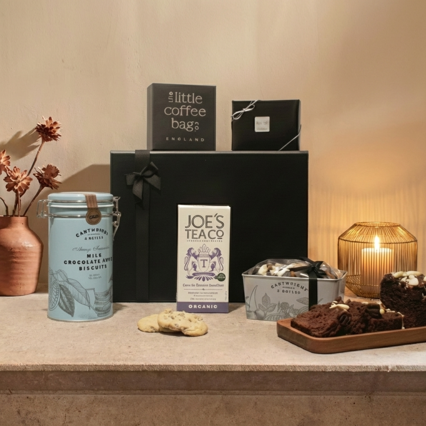 The Steward's Gift Hamper Selection featuring Cartwright & Butler Chocolate Loaf Cake tin, biscuits, and artisan coffee bags.