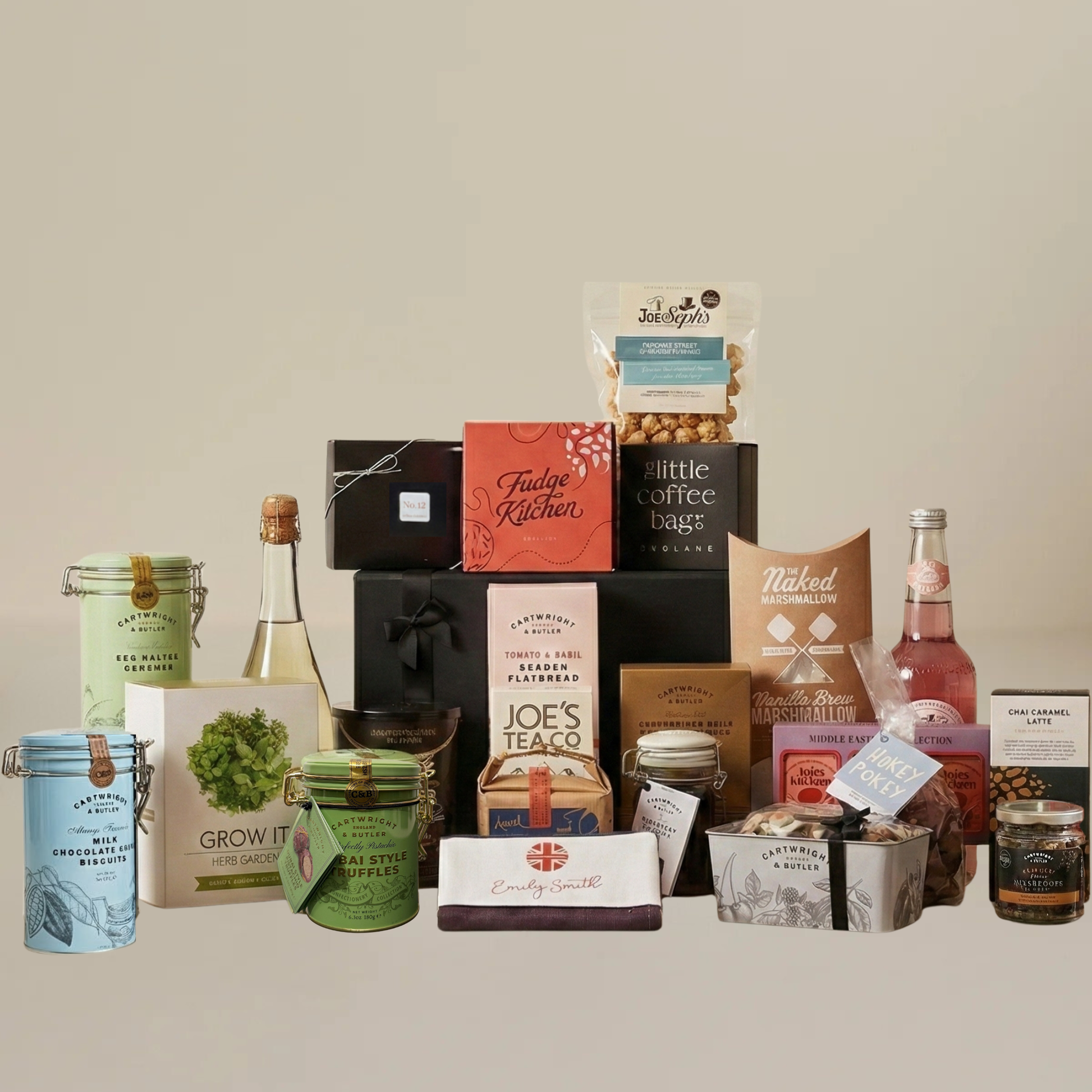 Large alcohol-free hamper flatlay with Dubai truffles, herb grow kit, Emily Smith tea towel, and artisan snacks.