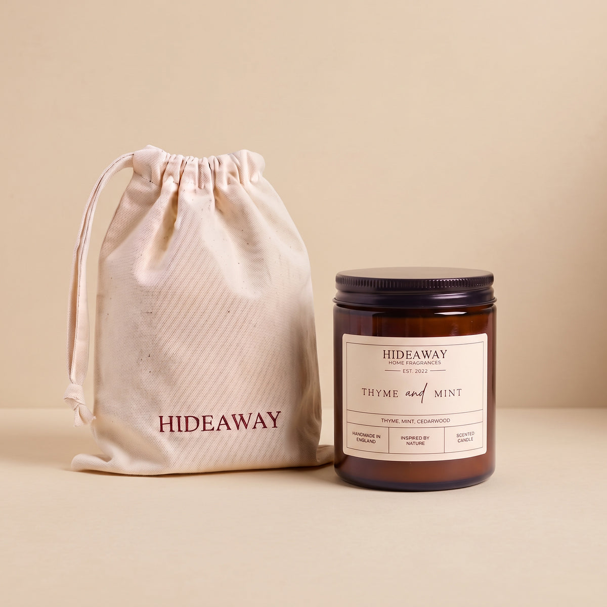 Refreshing thyme and mint aromatic candle in an amber glass jar creating an invigorating garden atmosphere from Hideaway Home Fragrances