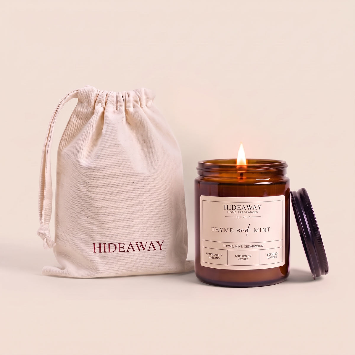 Thyme and mint amber glass candle with fresh herbal aromatic scent by Hideaway Home Fragrances
