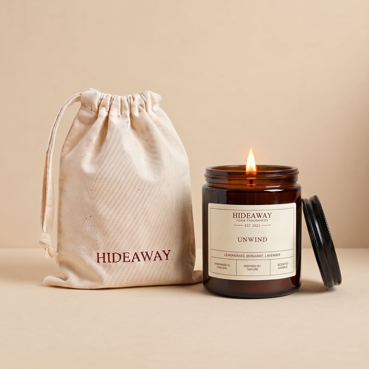 Unwind amber glass candle with relaxing soothing scent by Hideaway Home Fragrances